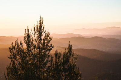 Scenic view of mountains against sky during sunset