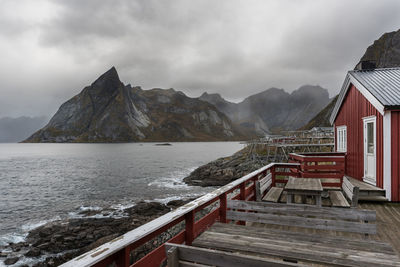 Scenic view of sea and mountains against sky