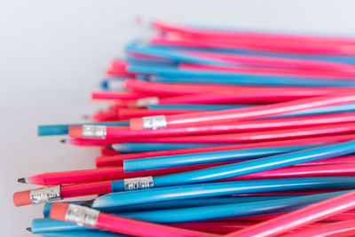 Close-up of pencils over white background