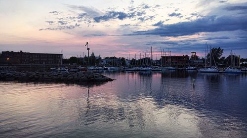 View of city at waterfront during sunset