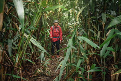 Portrait of man standing in field