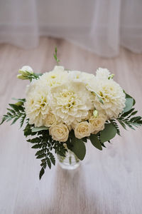 Close-up of white flower vase on table