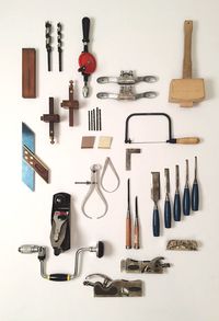 Close-up of work tools over white background