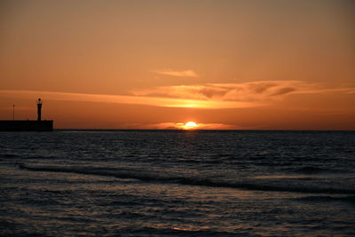 Scenic view of sea against sky during sunset