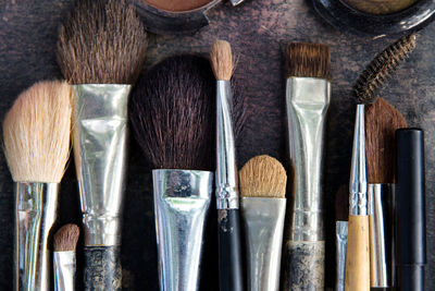 High angle view of make-up brushes on table