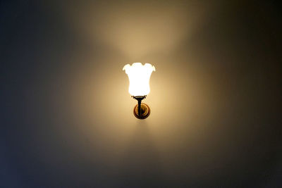 Low angle view of illuminated light bulb