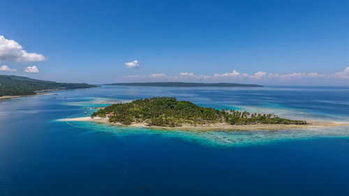 Scenic view of sea against blue sky