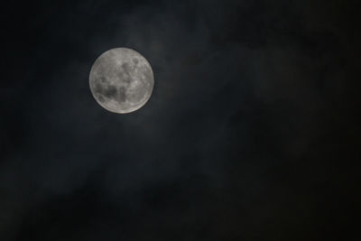 Low angle view of moon against sky at night