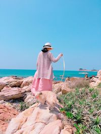 Rear view of woman on seashore