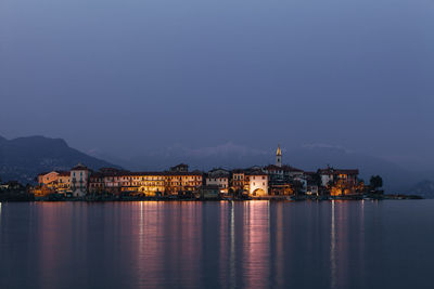 Illuminated buildings at waterfront