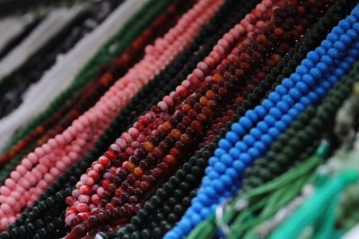 Beaded necklace hanging at retail stall