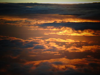 Low angle view of cloudy sky at sunset