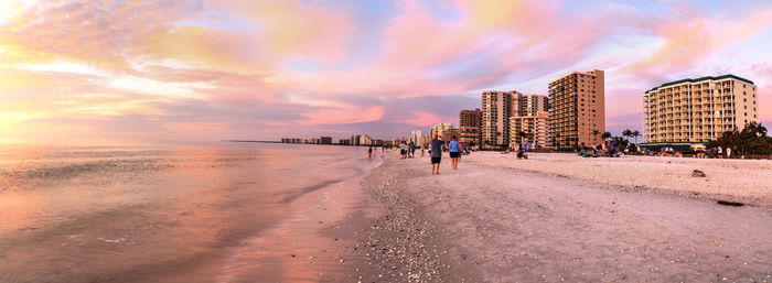 Pink and gold sunset sky over south marco island beach in florida