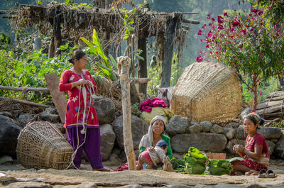 Portrait of people sitting outdoors