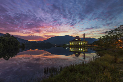 Scenic view of lake against sky during sunset