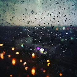 Full frame shot of wet glass window in rainy season