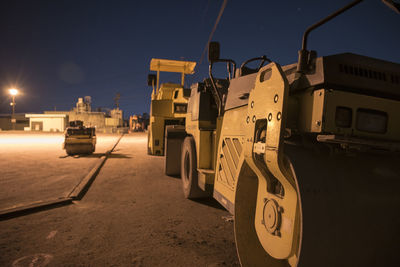 Vehicles parked on road at night