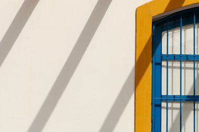 Low angle view of yellow building on sunny day