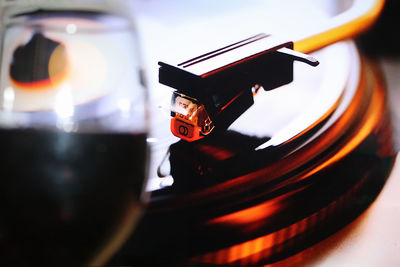 Close-up of wineglass and turntable
