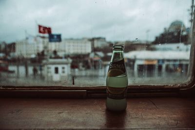 Close-up of glass bottle on table