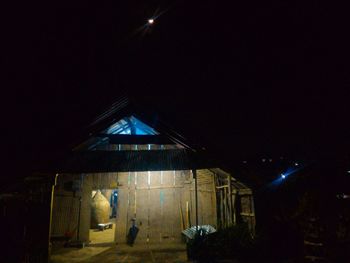 Low angle view of illuminated street light at night
