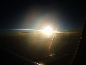 Sun shining through airplane