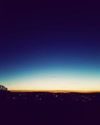 Scenic view of silhouette landscape against sky at night