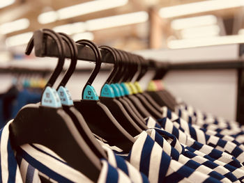 Close-up of clothes hanging in store