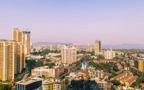 High angle view of buildings against clear sky
