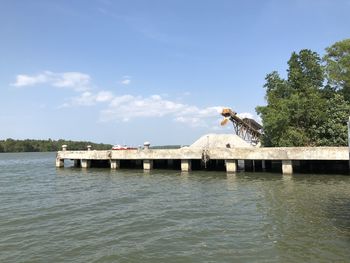 Scenic view of harbor against sky