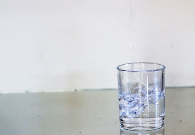 Close-up of water in glass on table