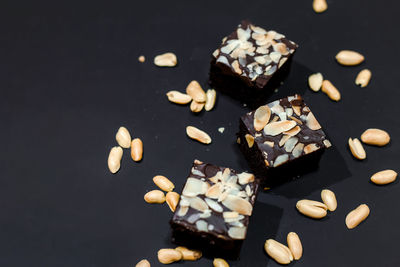 High angle view of chocolate cake on table against black background