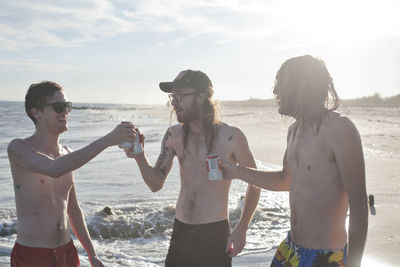 Young men hanging out on a beach