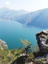 Scenic view of lake and mountains against sky