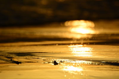 Scenic view of beach against sky during sunset