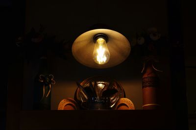 Low angle view of illuminated light bulb