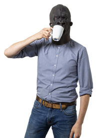 Midsection of person wearing mask against white background