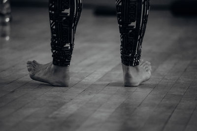 Low section of shoes on tiled floor