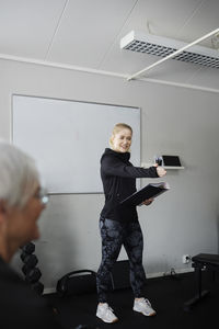 Female coach during presentation in gym