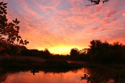 Scenic view of lake at sunset