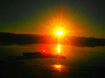 Scenic view of sunset over lake