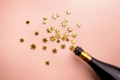 High angle view of christmas decorations on pink background