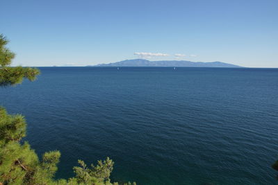 Scenic view of sea against blue sky