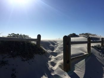 Scenic view of sea against clear sky on sunny day