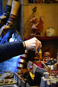 Cropped hand of woman shopping at market stall