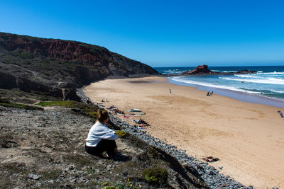 Girl sitting at the beach 