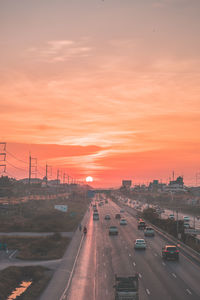 High angle view of traffic on road against sky during sunset