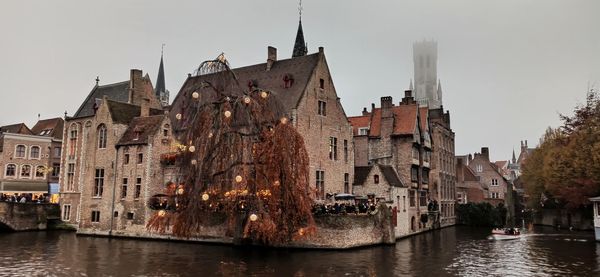 Panoramic view of river amidst buildings in city