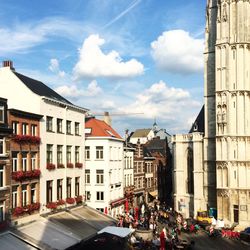 Cars in city against sky
