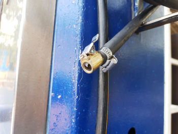 Close-up of metallic door on wood